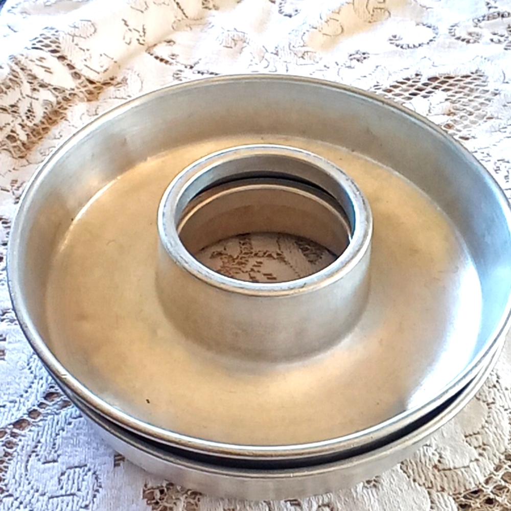 2 vintage Bundt ring cake pans or jello molds.